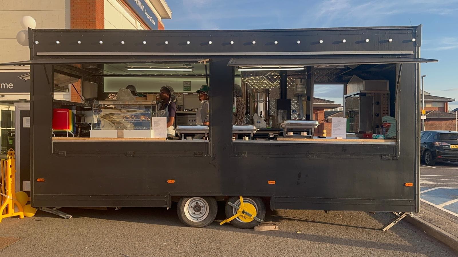 The Hot N Nice trailer with both hatches open — Front of Tesco Extra, Coulby Newham, Middlesbrough